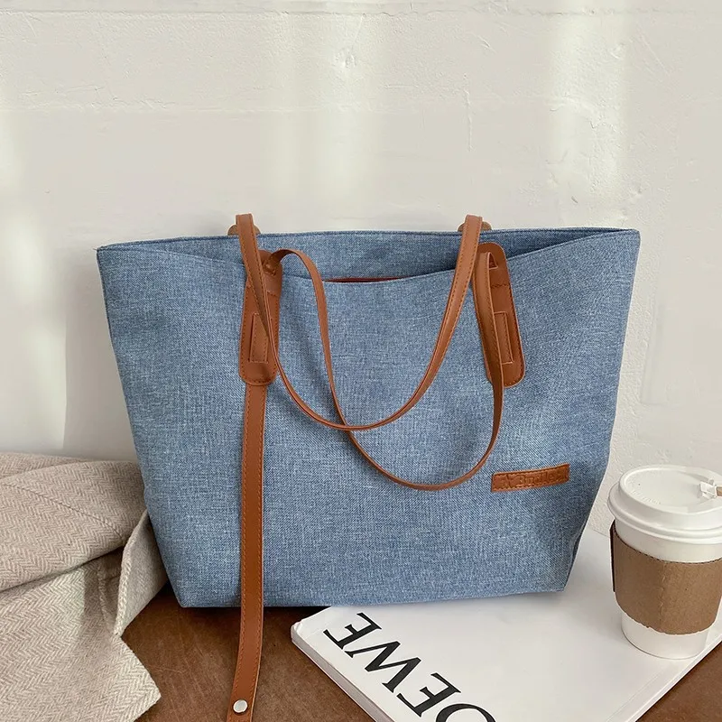 2021 Women's Autumn Winter New Solid Color Commuter Bag Large Capacity Fashion Simple Horse Pendant Shoulder Bag Female Brand