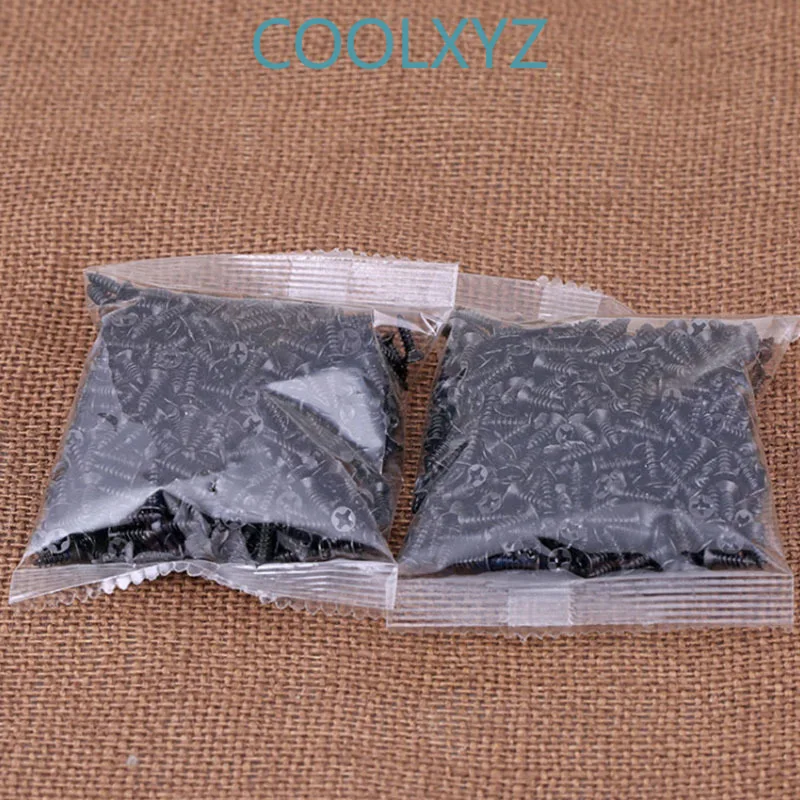 Черный крестообразный утопленный саморезающий винт с потайной плоской головкой