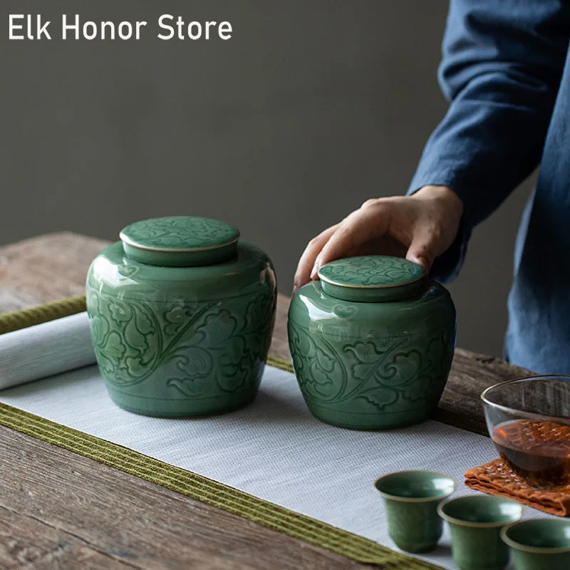

Yue Kiln Celadon Handmade Tangled Lotus Tea Pot Double-layer Sealed Moisture-proof Pot Kung Fu Tea Set Tea Storage Ceramic Pot