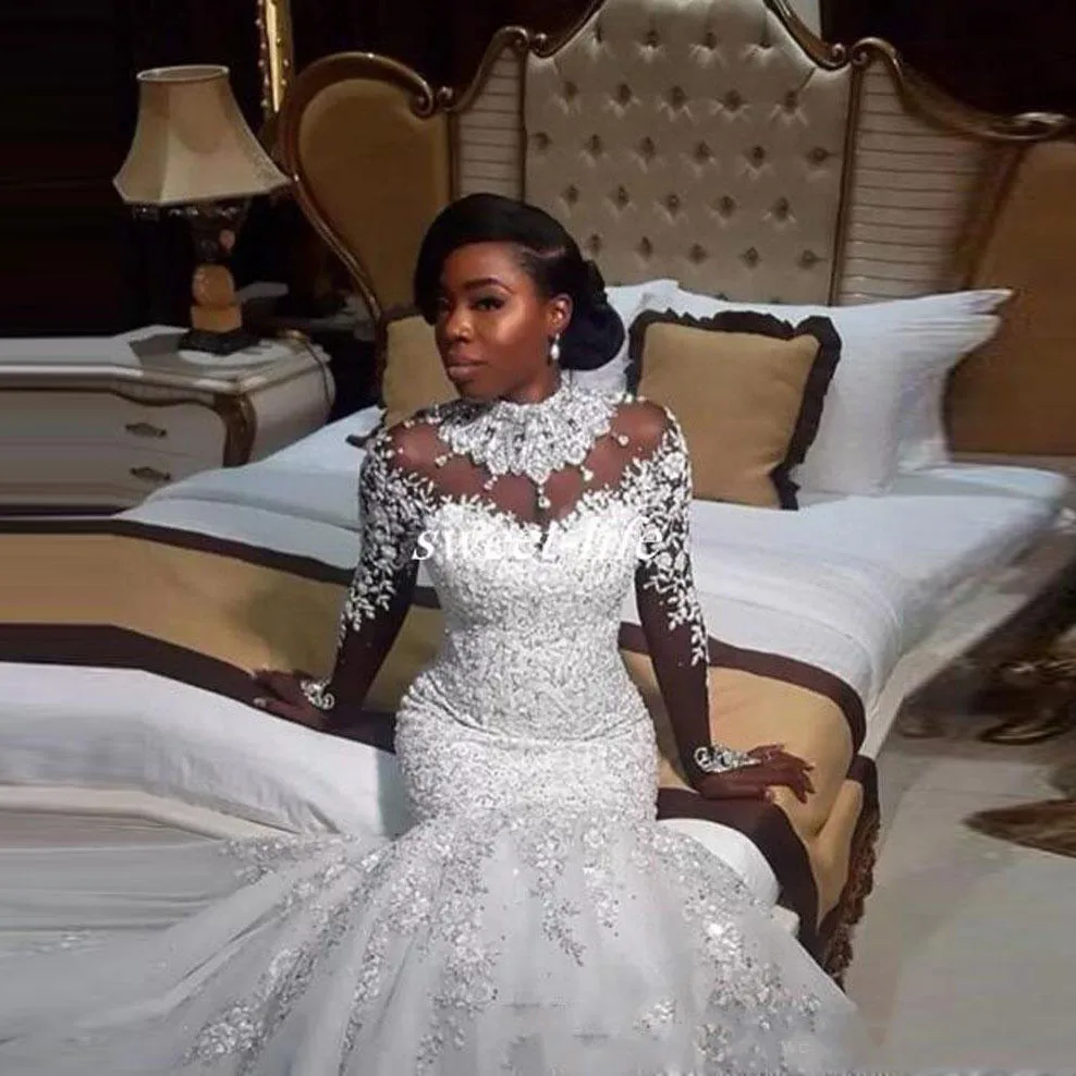 

Plus Size Wedding Gowns Sheer Neckline Transparent vestido de noiva Long Sleeves Bridal Dresses Crystals robe de mairee 2019