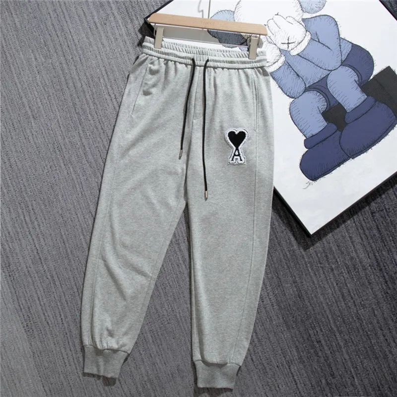 

Men's and women's same trousers AMI peach heart love string logo embroidered cuffed footwear loose couple sports trousers trendy