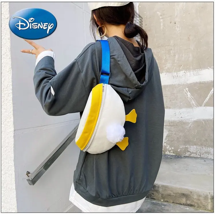 

Disney «Дональд Дак» в Корейском стиле, украшенное пушистыми помпончиками для девочек мешок милые сумка на плечо, через плечо