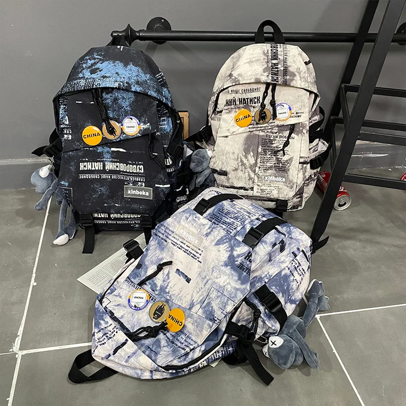 Japanese fashion backpack men's 2022 new Korean fashion casual high-capacity student backpack junior high school bag. purses