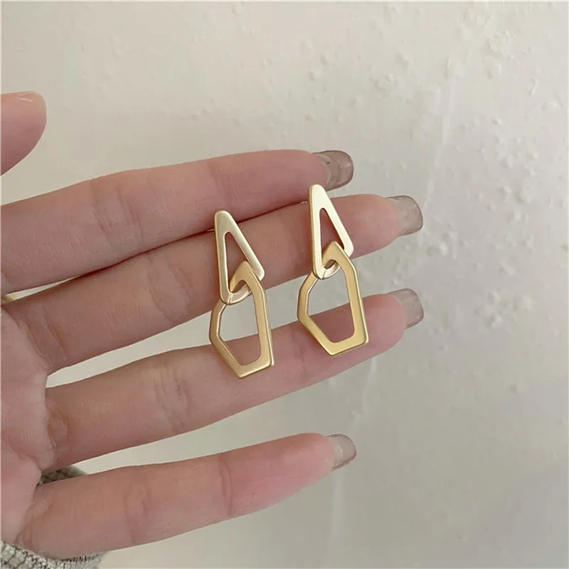 

Cold wind irregular geometric metal material earrings girl temperament of restoring ancient ways matte stud earrings