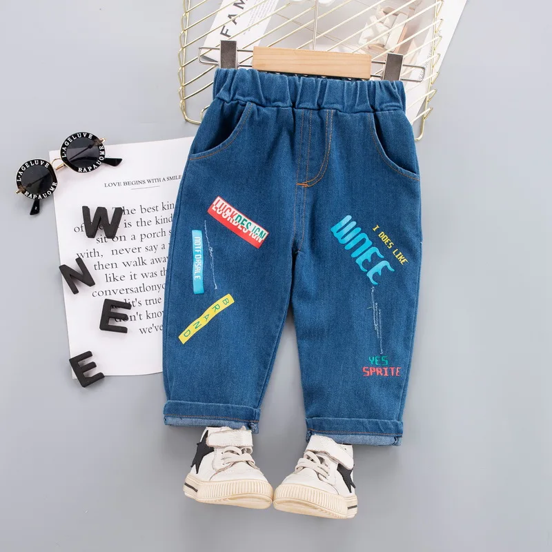 

Новинка 2021, Детские демисезонные штаны с мультяшным рисунком, модные джинсовые штаны с дырками на талии для девочек и мальчиков, одежда для ...