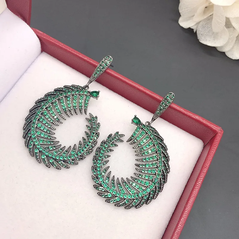 

European and American exaggerated micro-inlaid green diamonds sexy enchanting leaf arc earrings tropical plants holiday style ea