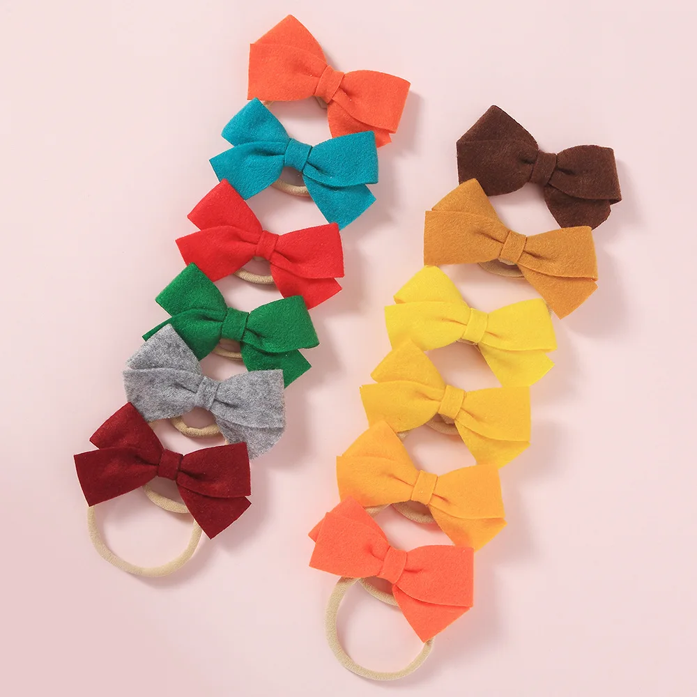 

Solid Color Non-woven Bowknot Headbands Fabric Children DIY Headwear Nylon Headbands Seamless Hairbands for Girls Baby Hair Bows