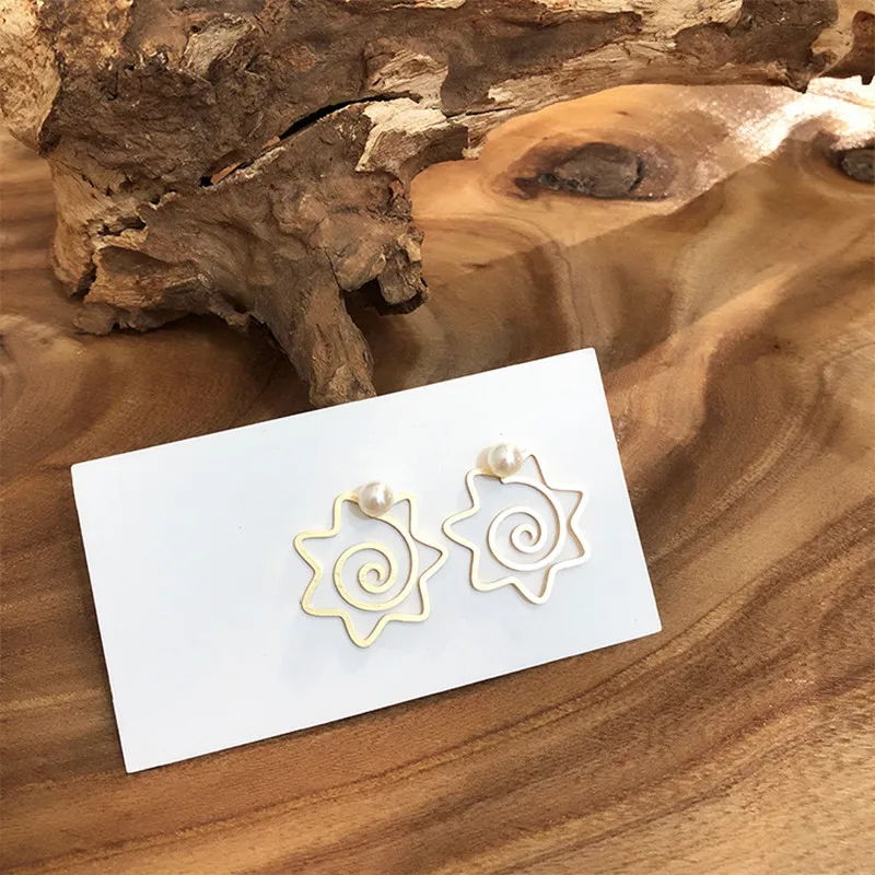 

Aestheticism fashion personality contracted hollow stud earrings metal two wear a flower geometry matte frosted earrings