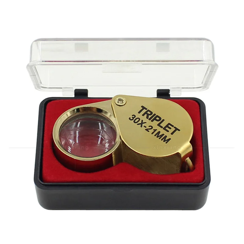 

Складная карманная лупа золотого цвета