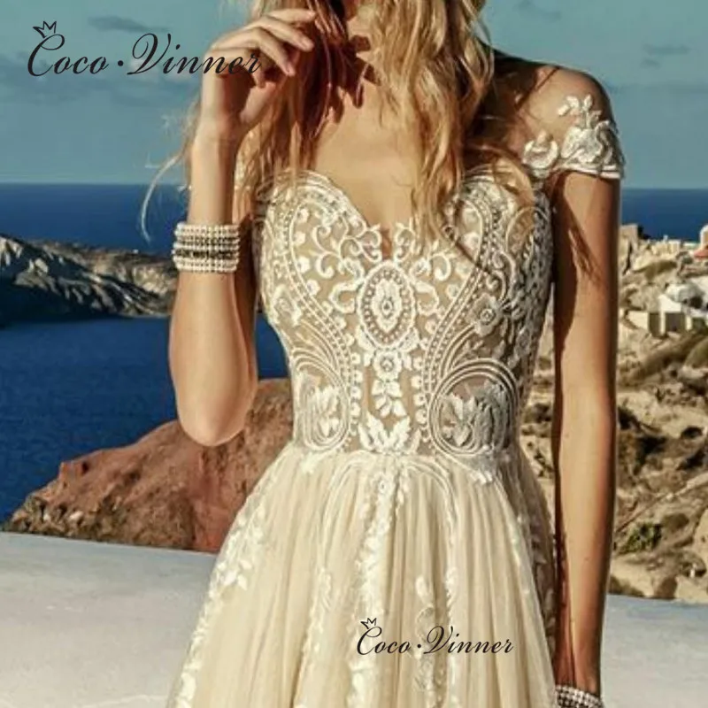 

Cap Sleeves Delicate Embroidered Lace on Net Illusion Tulle Beach Wedding Dresses Button Vestido Novia Negro Champagne W0619