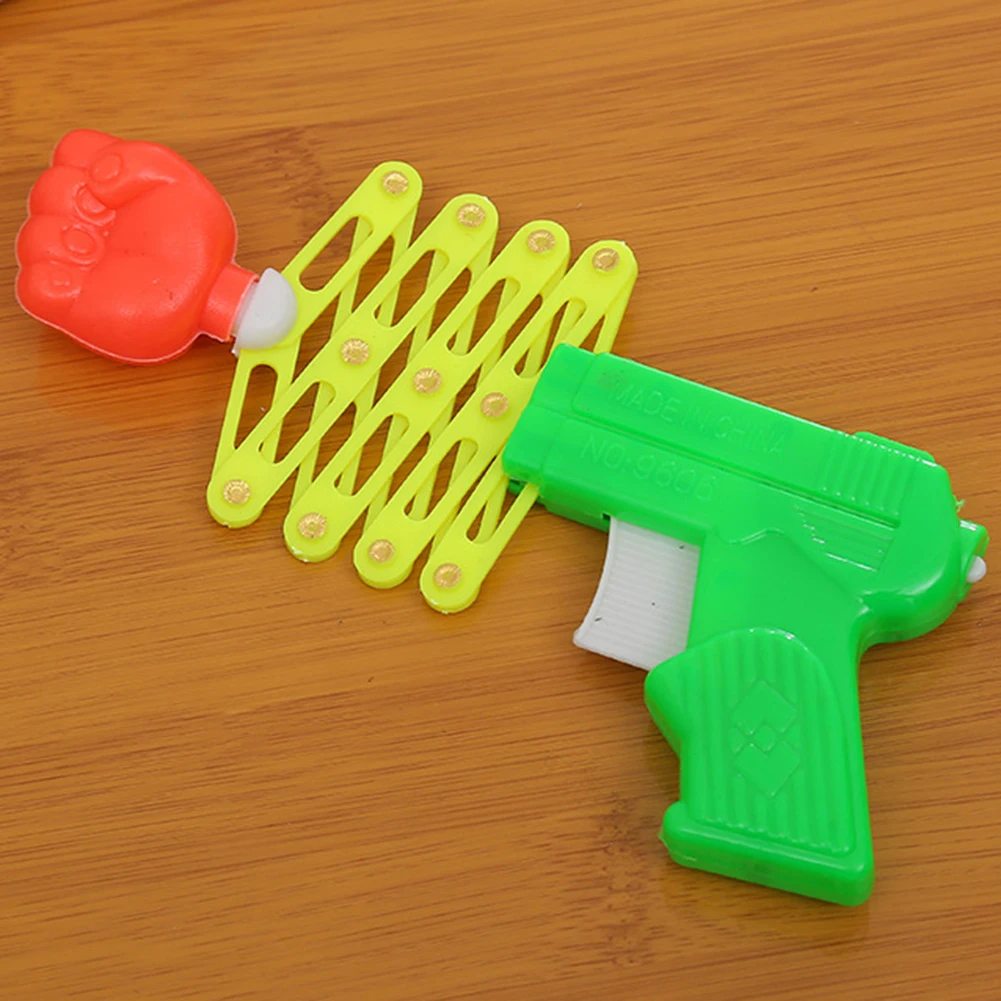 

Retractable Fist Shooters Trick Toy Gun Funny Kids plastic Party Festival Gift Classic Elastic Telescopic Fist Toys For Children