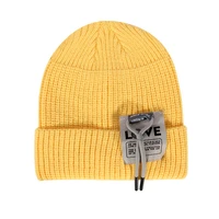 new autumn and winter hat with rope fashion bright color ear protection warm hat outdoor hedging cold woolen hat
