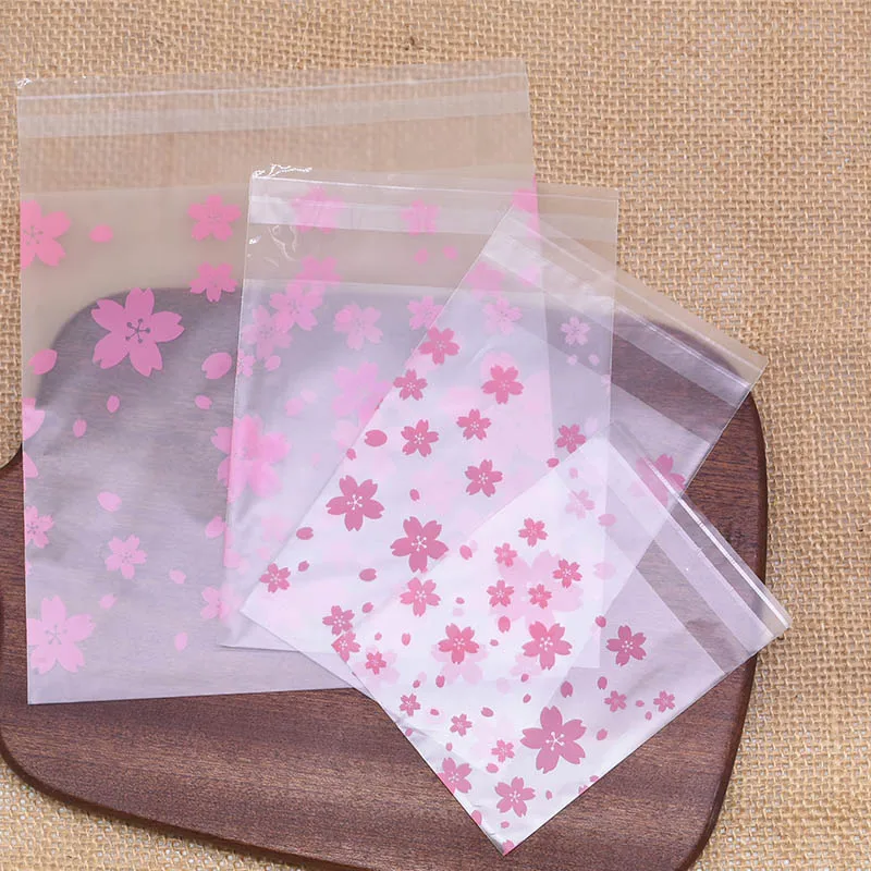 

50pcs 7x7 8x10 10x10 14x14cm Pink Cherry Blossom Printing Transparent Gift Bags Pouch for Party Bags Birthday Candy Package Bag