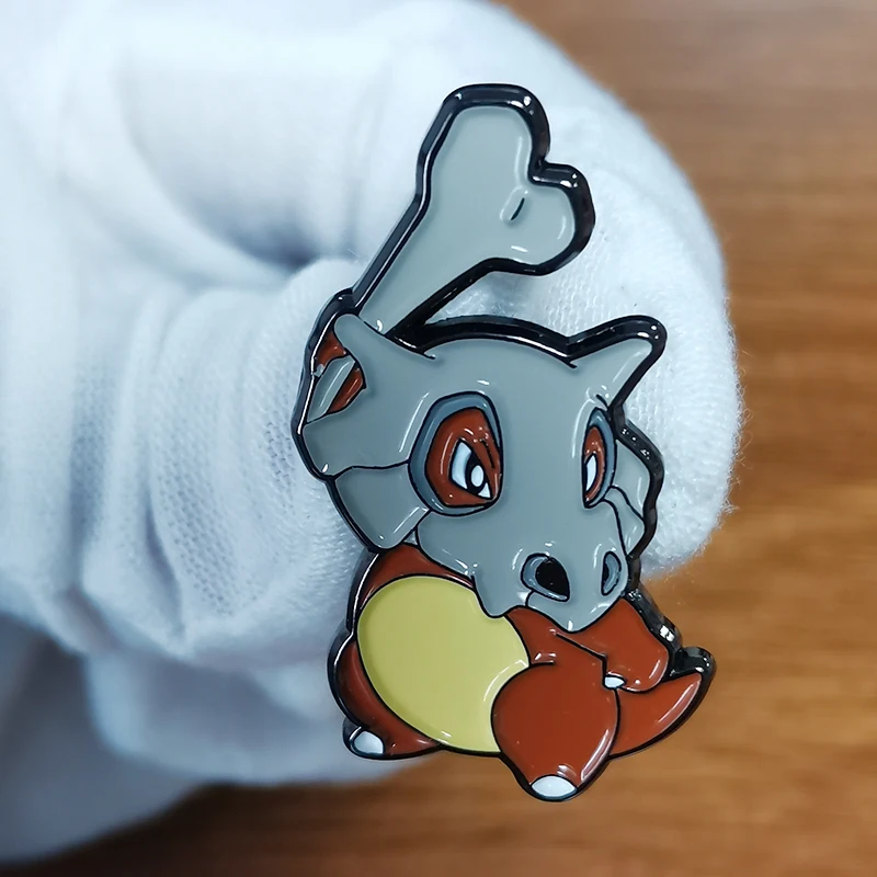 

Cubone Lapel Pin he is so cute to poops a lot and makes bvirds.