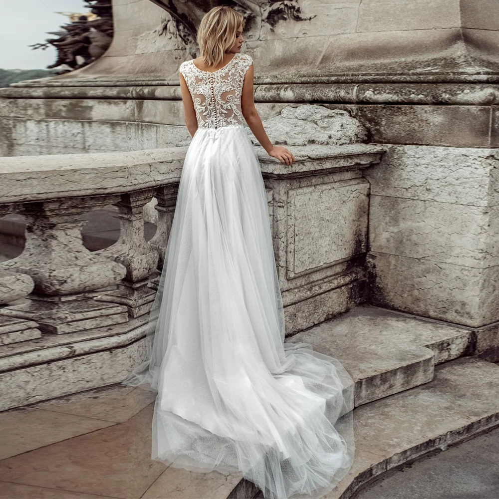 

Vestidos Elegant Wedding Dresses Tulle Illusion Appliques Pearls Bateau Sleeveless Covered Button A-Line Bridal Gowns