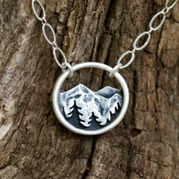 creative feature silver color mountain and pine tree round pendant necklace womens holiday fashion jewelry
