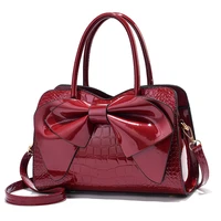 womens bag 2021 new bright leather handbag large capacity atmosphere fashion middle aged one shoulder messenger