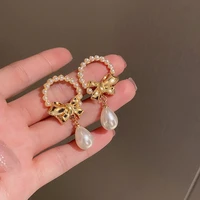pearl bowknot earrings french retro rice bead earrings gentle temperament lady literary style earrings