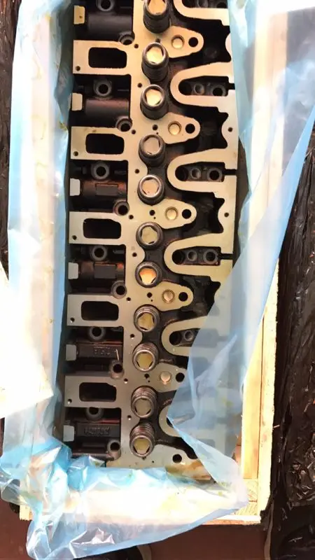 

deutz D6E cylinder head assembly contains a valve spring assembly