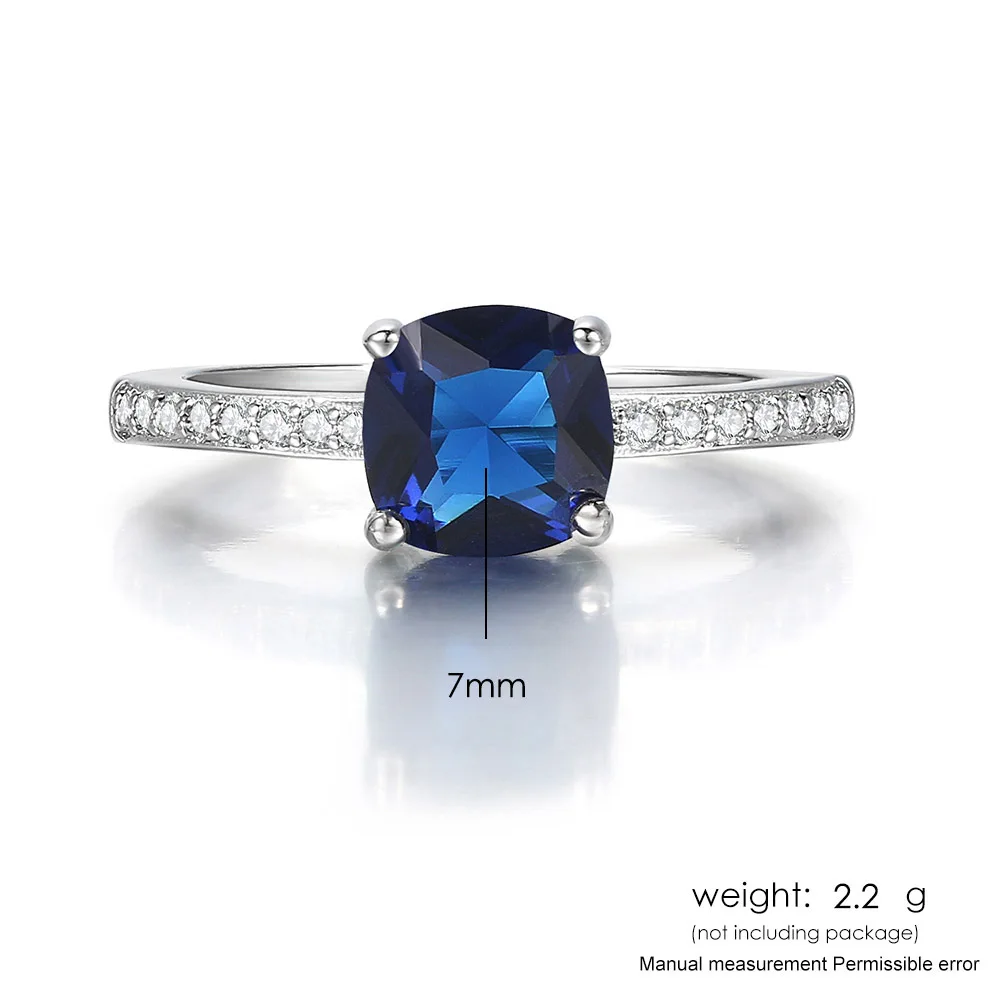 Женское кольцо с квадратным фианитом серебристое четырьмя закрепками зеленый и