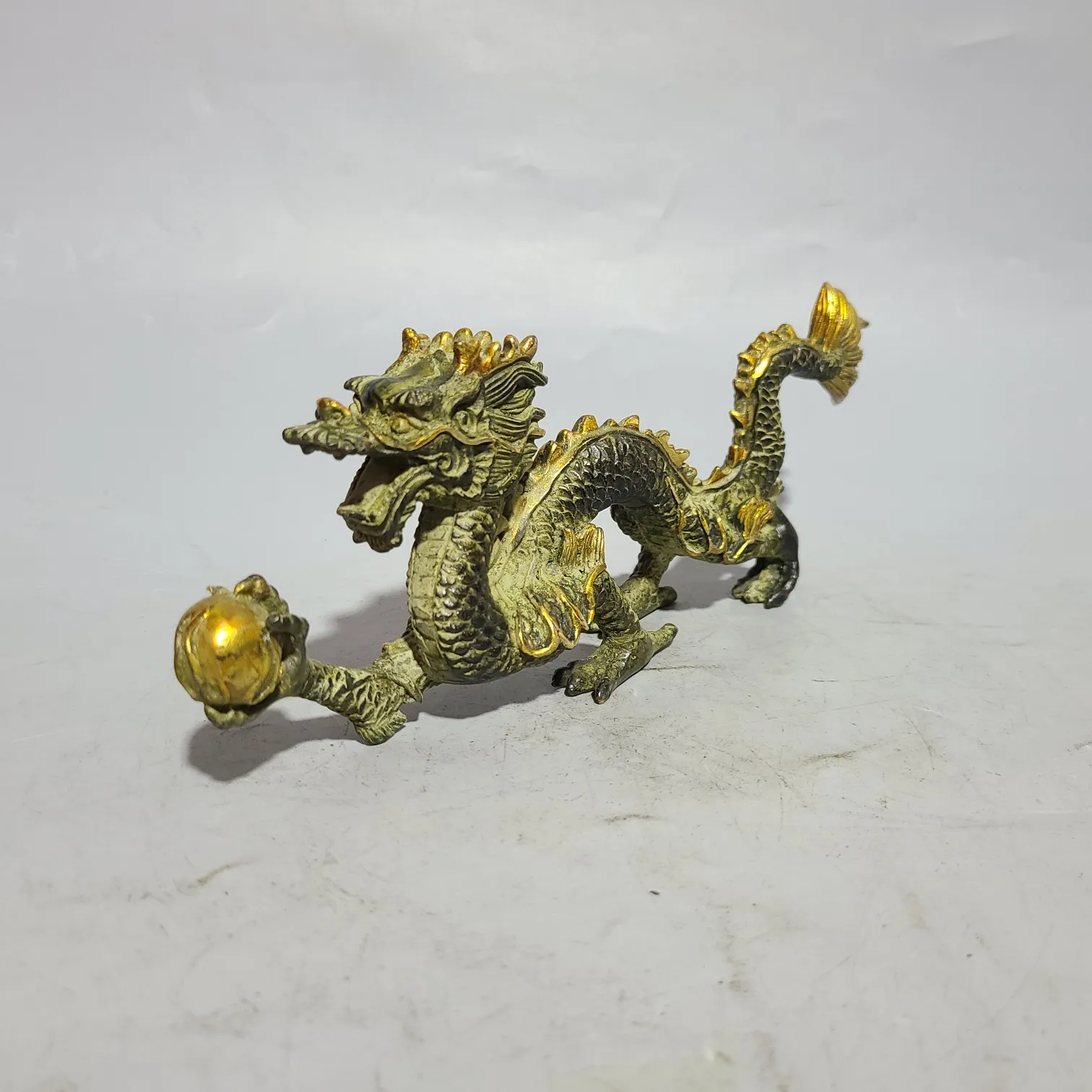 Exquisite antique furniture ornaments made of old bronze flying dragon playing with beads