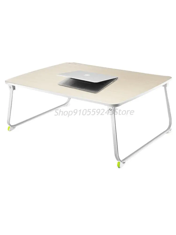 Положить на кровать складной столик с ламинированным покрытием передвижные