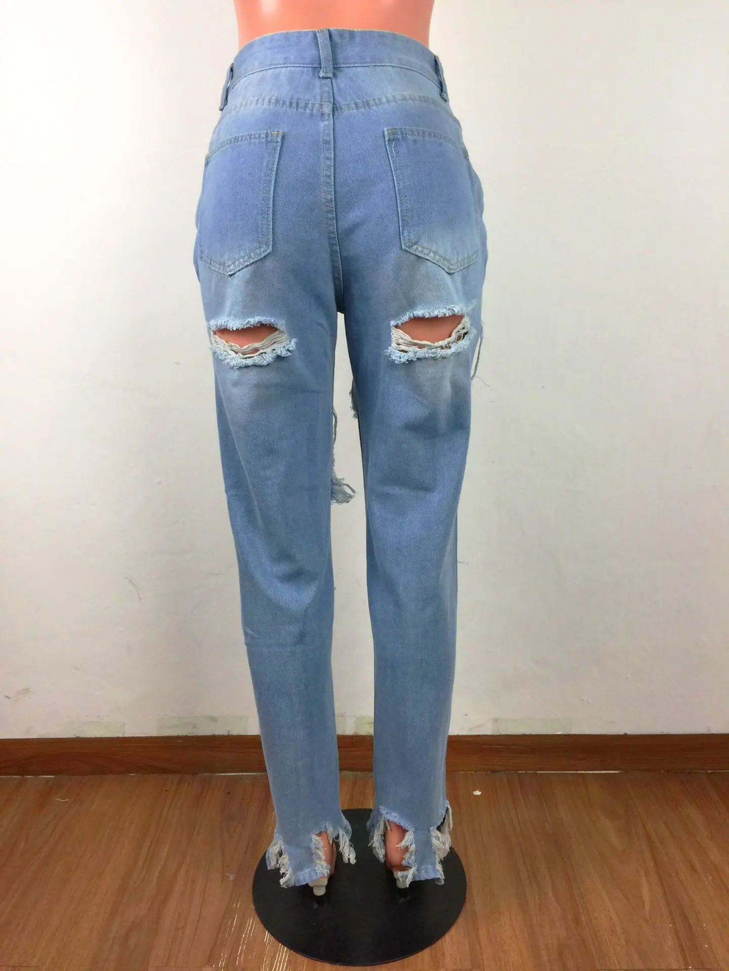 

Pencil jeans with ripped tassels and irregular slits