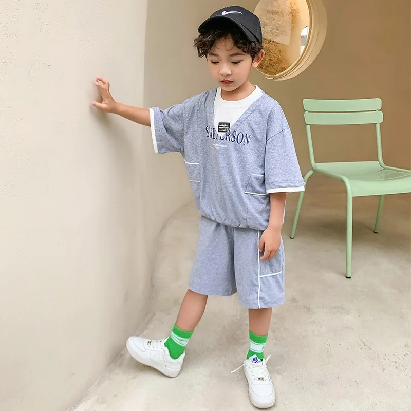 

Kids boys summer suit short sleeve T-shirt + spell color thin section shorts 2pcs sets of new big virgin suit 4-12 years old