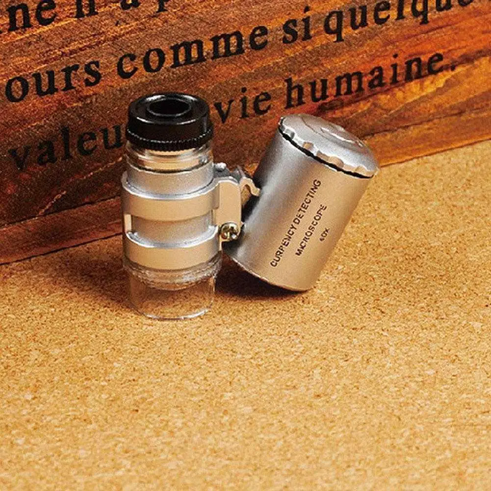 

Mini 60x Handheld Microscope Loupe Jeweler Magnifier Counterfeit with LED J5M5 Lamp Glass Light Mini R9D6