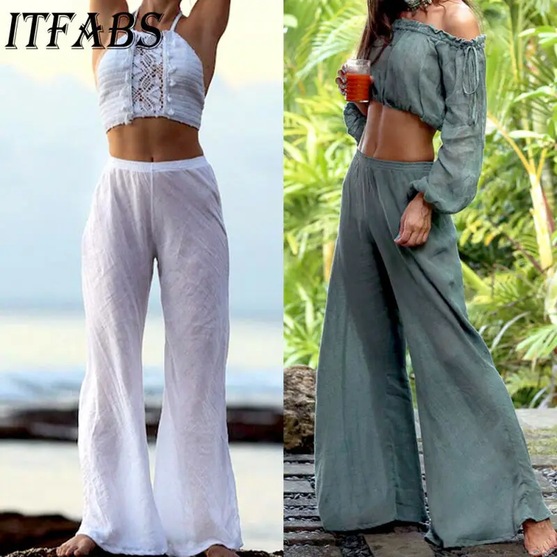 Женские брюки с широкими штанинами однотонные расклешенные разрезом высокие