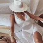 Новинка Лето 2022 Европейское и американское модное прозрачное вязаное крючком пляжное платье на бретелях с V-образным вырезом и лямкой на шее