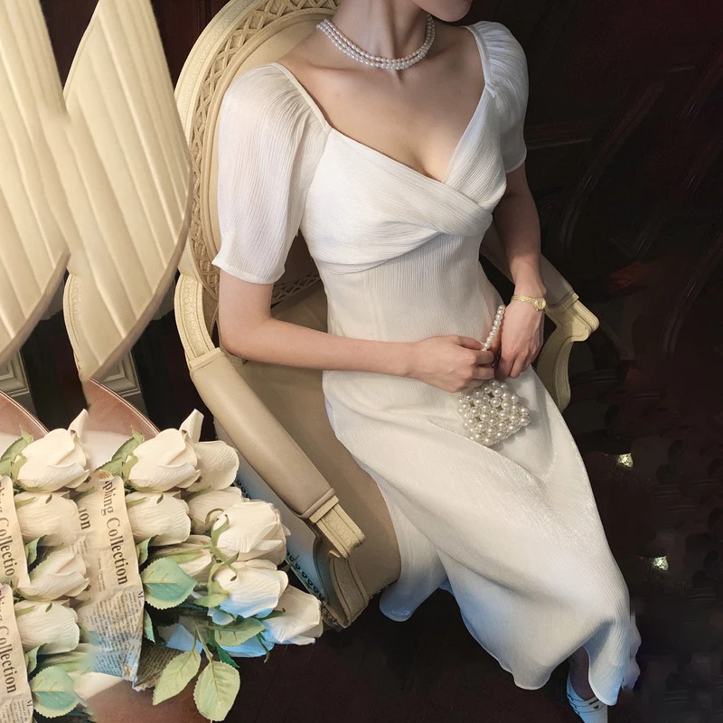 

VICONE Glossy neckline twist dress