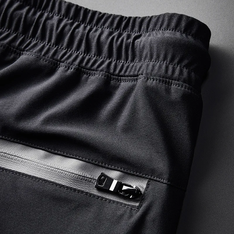 

For men, the new summer line of cropped ice slacks is popular logo oversize men's sport pants
