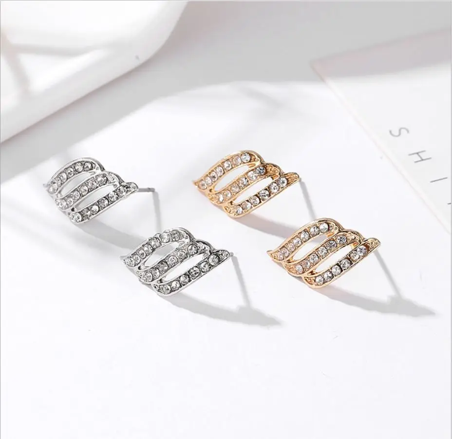 Женские серьги-гвоздики в виде крыльев Ангела инкрустированные кристаллами и