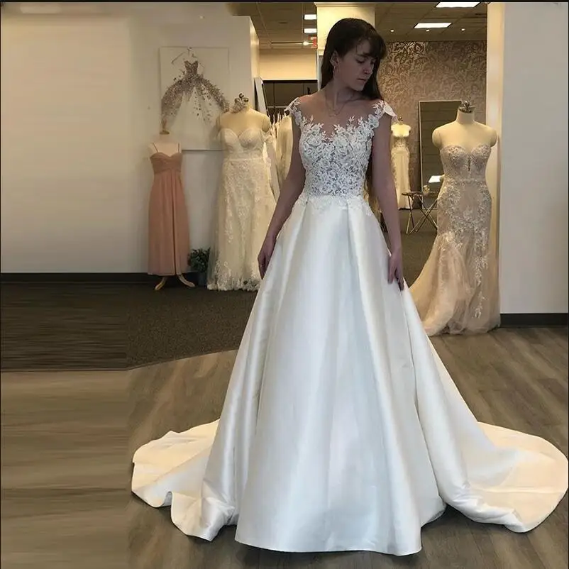 

Elegant Illusion Wedding Dress Nude Tulle Sheer Neck 3D Lace Appliques Cap Sleeve Satin A Line Long Bridal Gown Vestido de noiva
