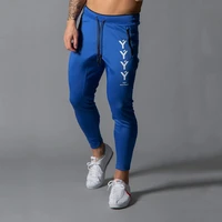 2021 spring and autumn new muscle brothers sports fitness pants mens pocket patchwork casual foot pants slim fit stretch pants