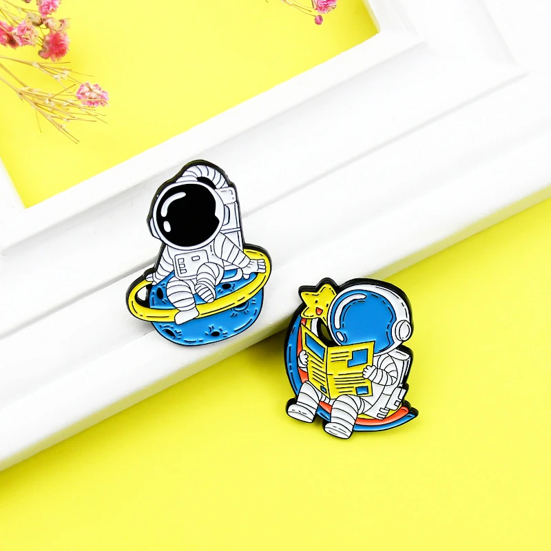 

Fashion Unique Pilot Planet Brooch Suitable For Daily Cute Cartoon Astronaut Reading A Newspaper Creative Astronaut Brooch