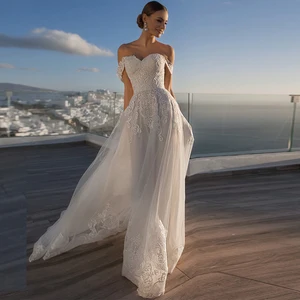 Charming A-Line Sweetheart Wedding Dresses 2021 Off The Shoulder Lace Appliques Backless Tulle Beach Bridal Gown Sweep Train