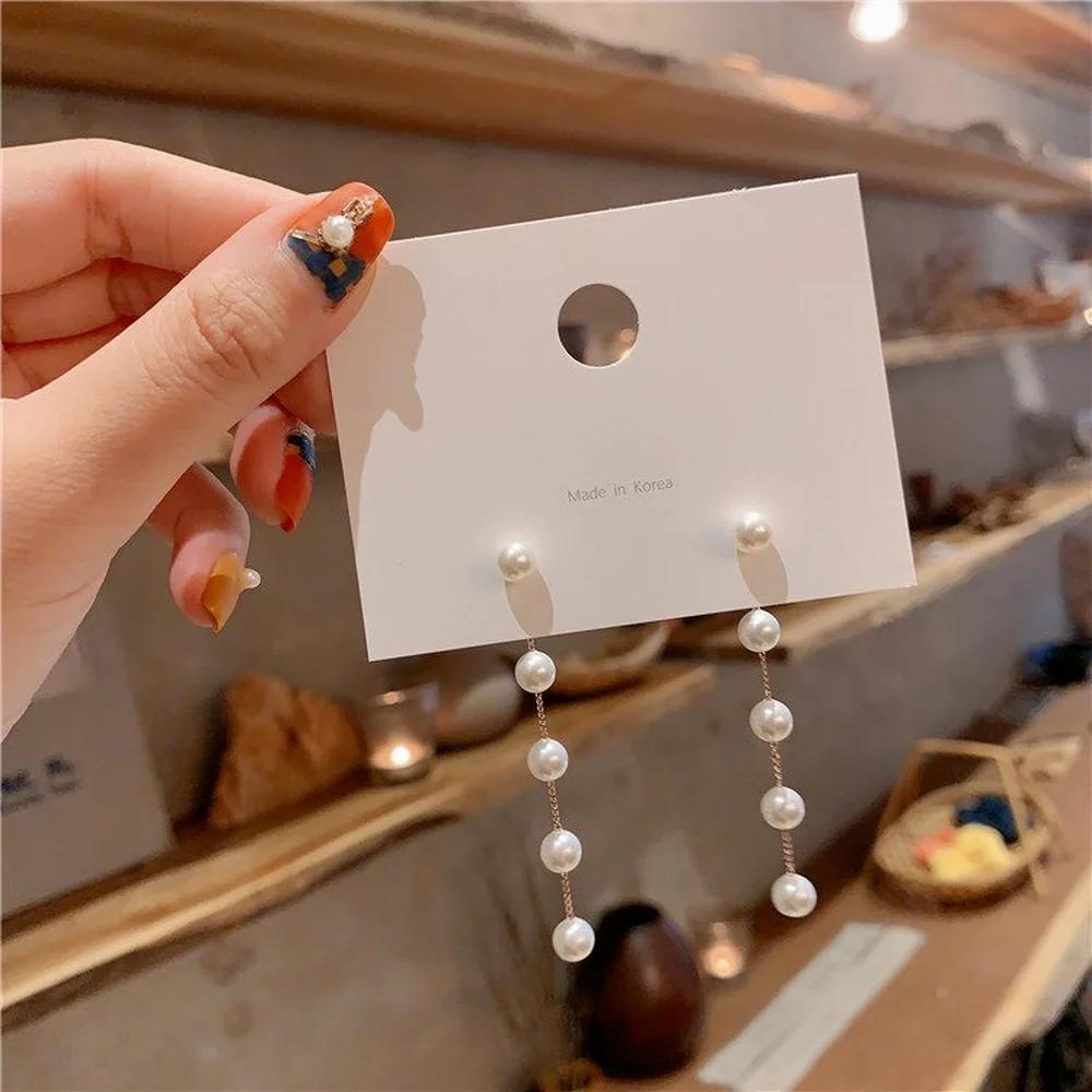 

2021 new Japanese and Korean fashion ladies party alloy long pearl tassel earrings popular design fashion trend style earrings