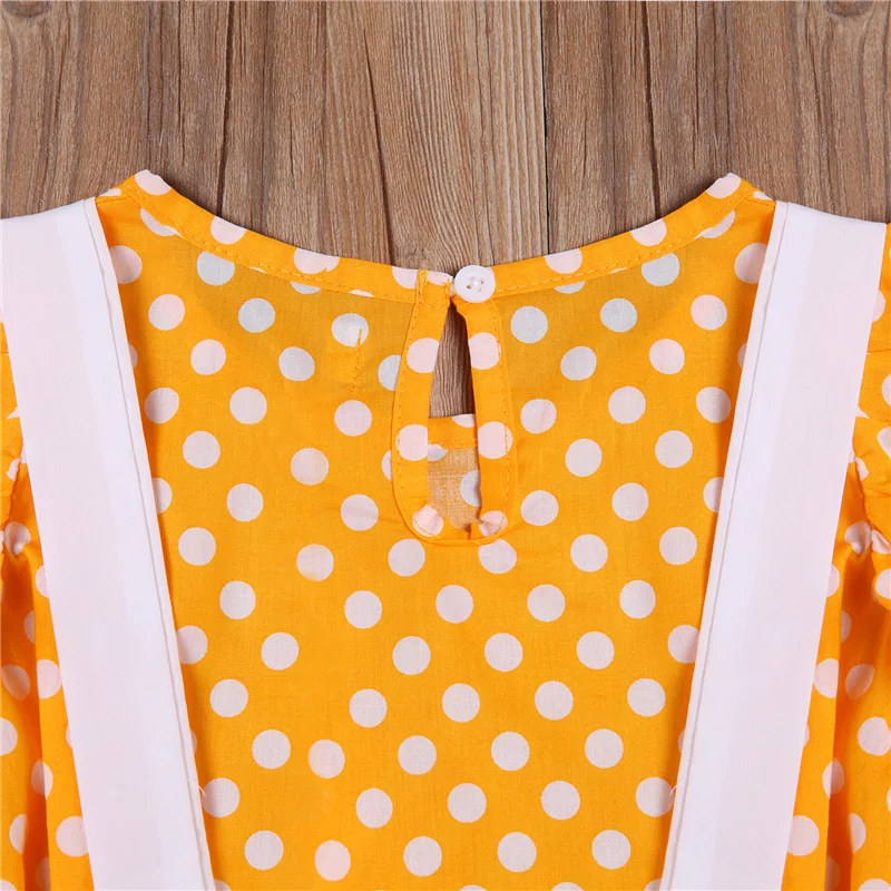 

2Pcs Kids Girls Clothes Casual Set Yellow Polka Dot Print O-neck Fly Sleeve Pullover Solid Color Suspender Skirt