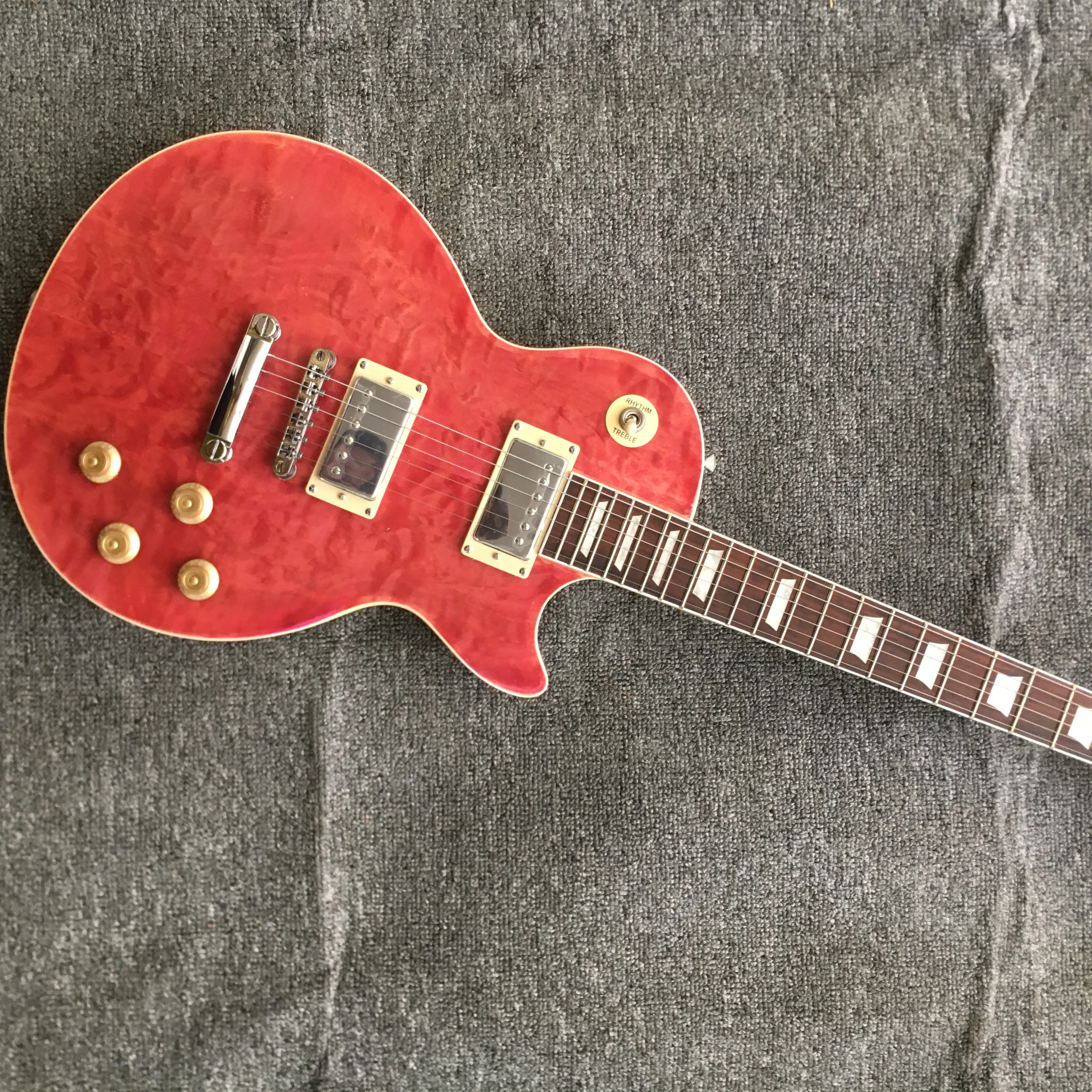 

Wholesale custom shop, quilted maple top,mahogany wood body and neck pink color in stock free shipping