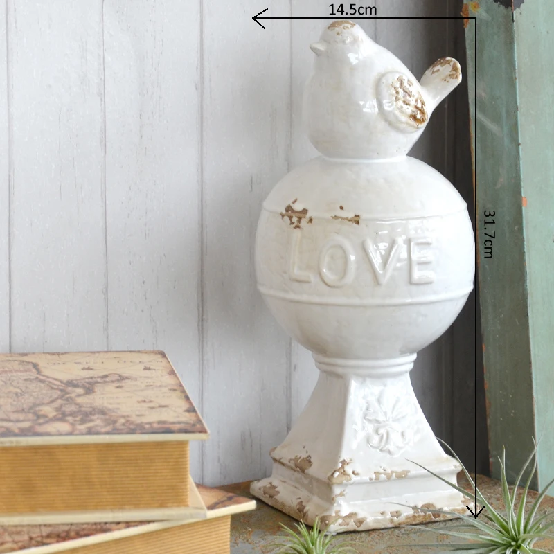 

Vintage White Ceramic Tabletop Bird Figurine With Love Signs Round Ball In Middle And Square Bottom Base Country Accents Craft
