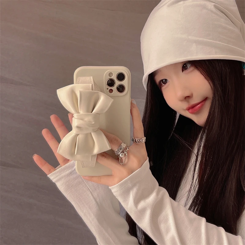 

Cortical Wrist Strap Phone Case For iPhone 7 8 Plus With Bowknot 11 12 Pro Max Luxury Fashion X XR XS Max Soft Silicone Case