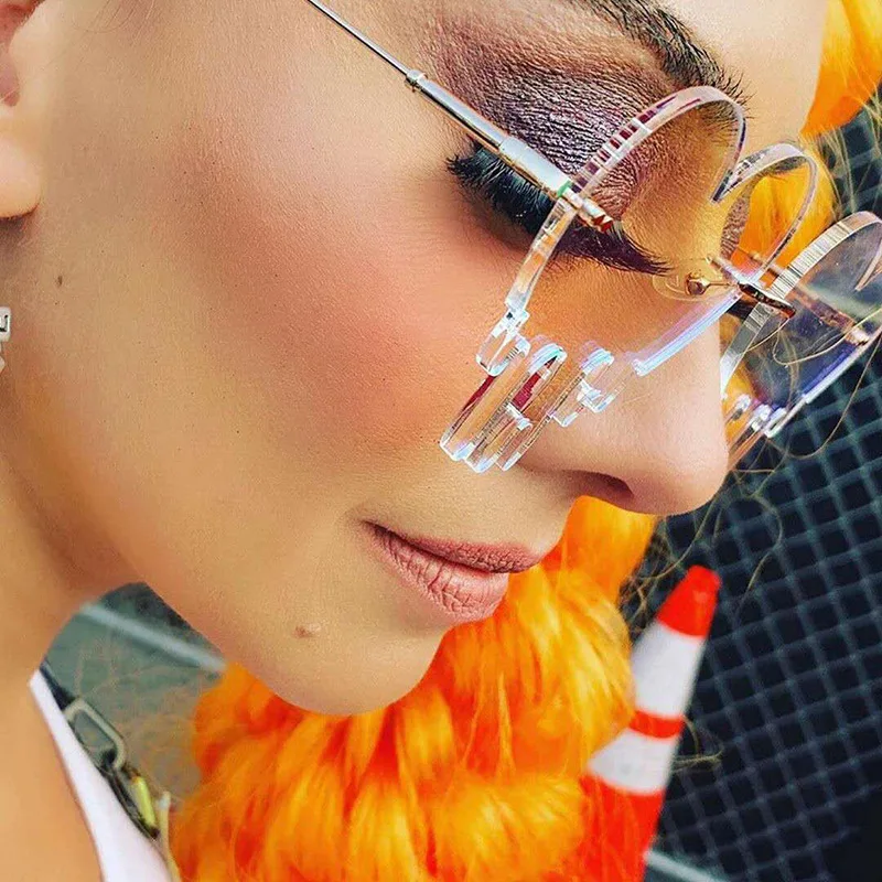 Модные плавильные солнцезащитные очки в форме сердца женские без оправы стиле