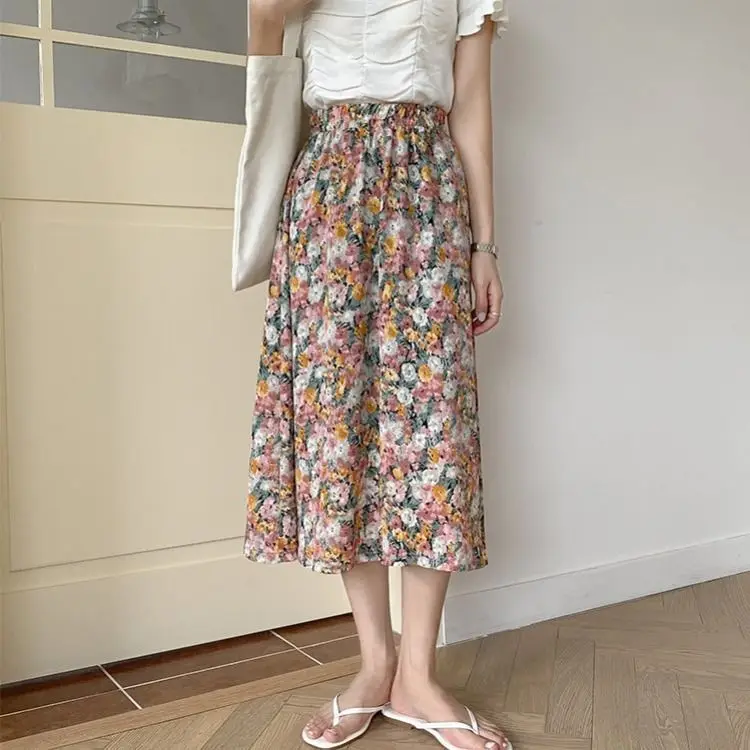 

A-line skirt, floral skirt, half length skirt, Xia Zhong long, high waist and thin Chiffon student's versatile a-fairy skirt