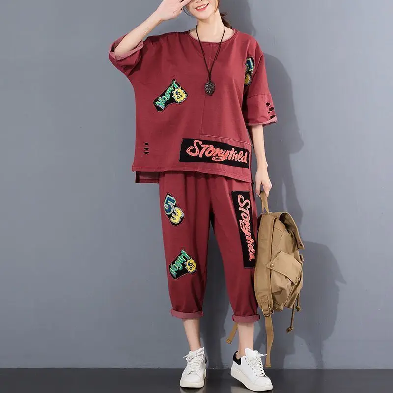 

Single Cotton Summer New Loose Fit Women's Large Size Holed Top Pasted Fabric Printing Casual Two Piece Women Pants Outfit