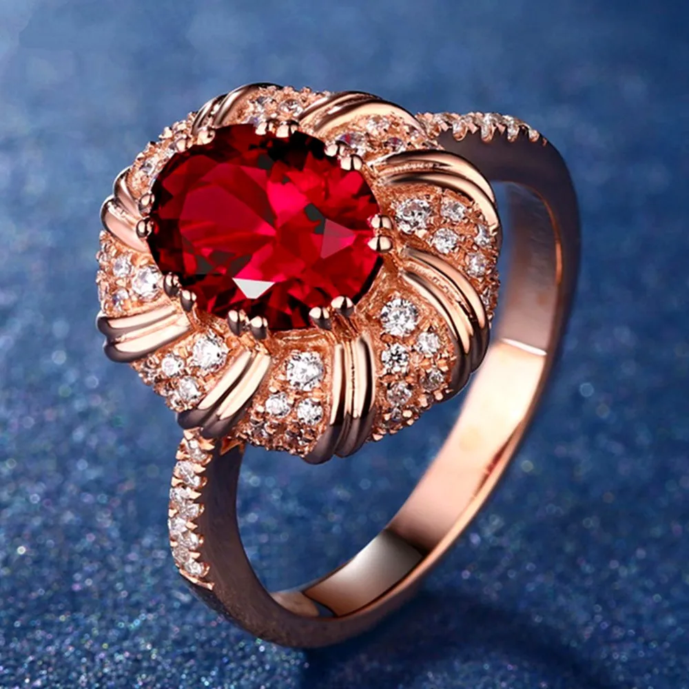Фото Кольцо женское под розовое золото с рубинами и красными кристаллами sizes678910 |