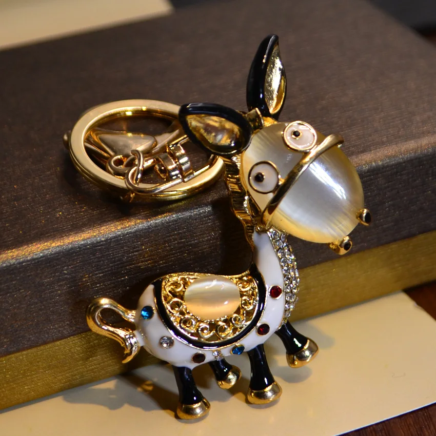 

Gift box packaging personality opal cute little donkey keychain car key chain pendant female exquisite bag pendant couple gift
