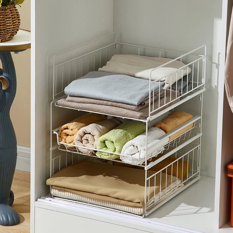 

Inside the wardrobe, layered partition drawers pushed and pulled into racks with multiple layers of superimposed clothing racks