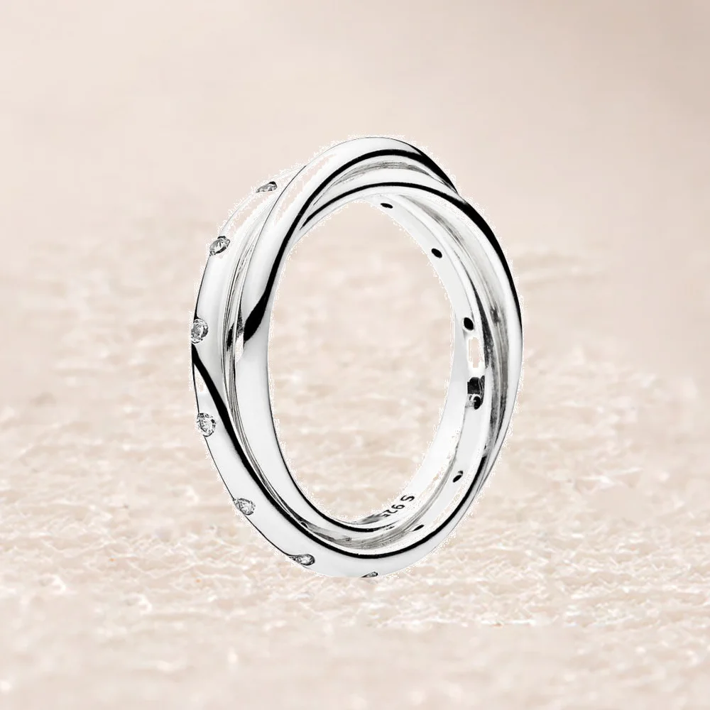 

191034CZ SWIRLING SYMMETRY RING
